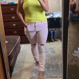 Pale pink distressed skinny jeans